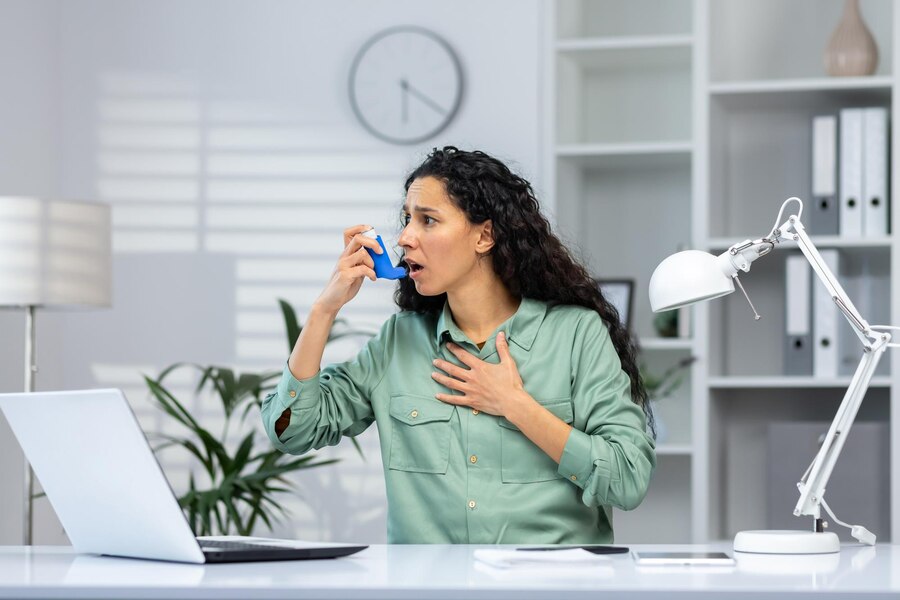 asthma-attack-hispanic-business-woman-inside-office-workplace-with-laptop-woman-uses-inhaler